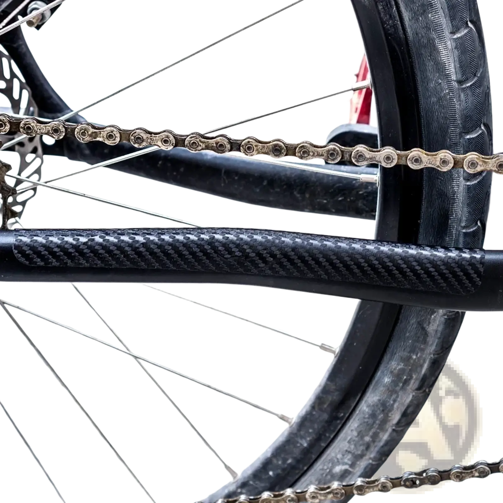 Black pvc bike chain protector with carbon fiber textured guard shown from the back side