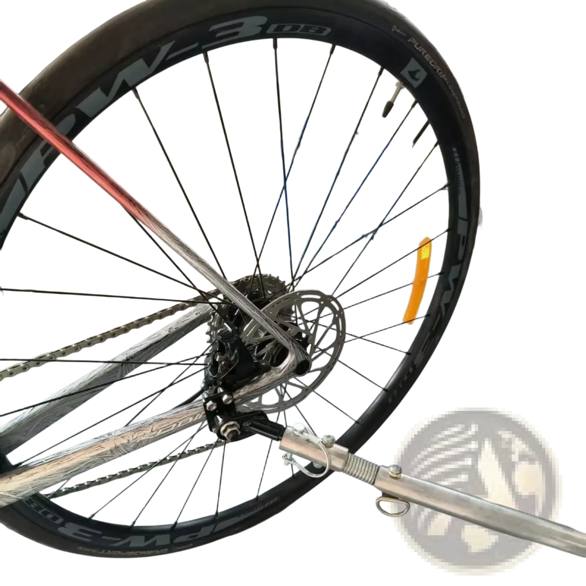 Silver metallic bike trailer hitch coupler with black tire and visible pw-3 08 rim spokes for bicycle connector adapter