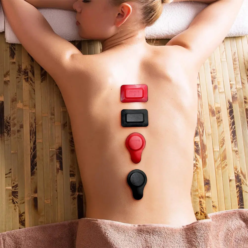 Red and black silicone-backed massage pads arranged vertically along the spine in a 22 piece ferrite and leather biomagnetic therapy magnet kit