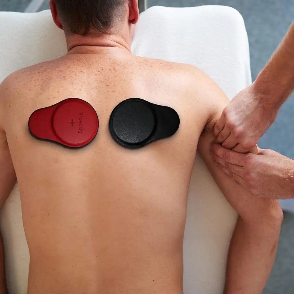 Red and black circular ferrite biomagnetic massage pads with plus sign branded kneipp from magnetrx professional kit