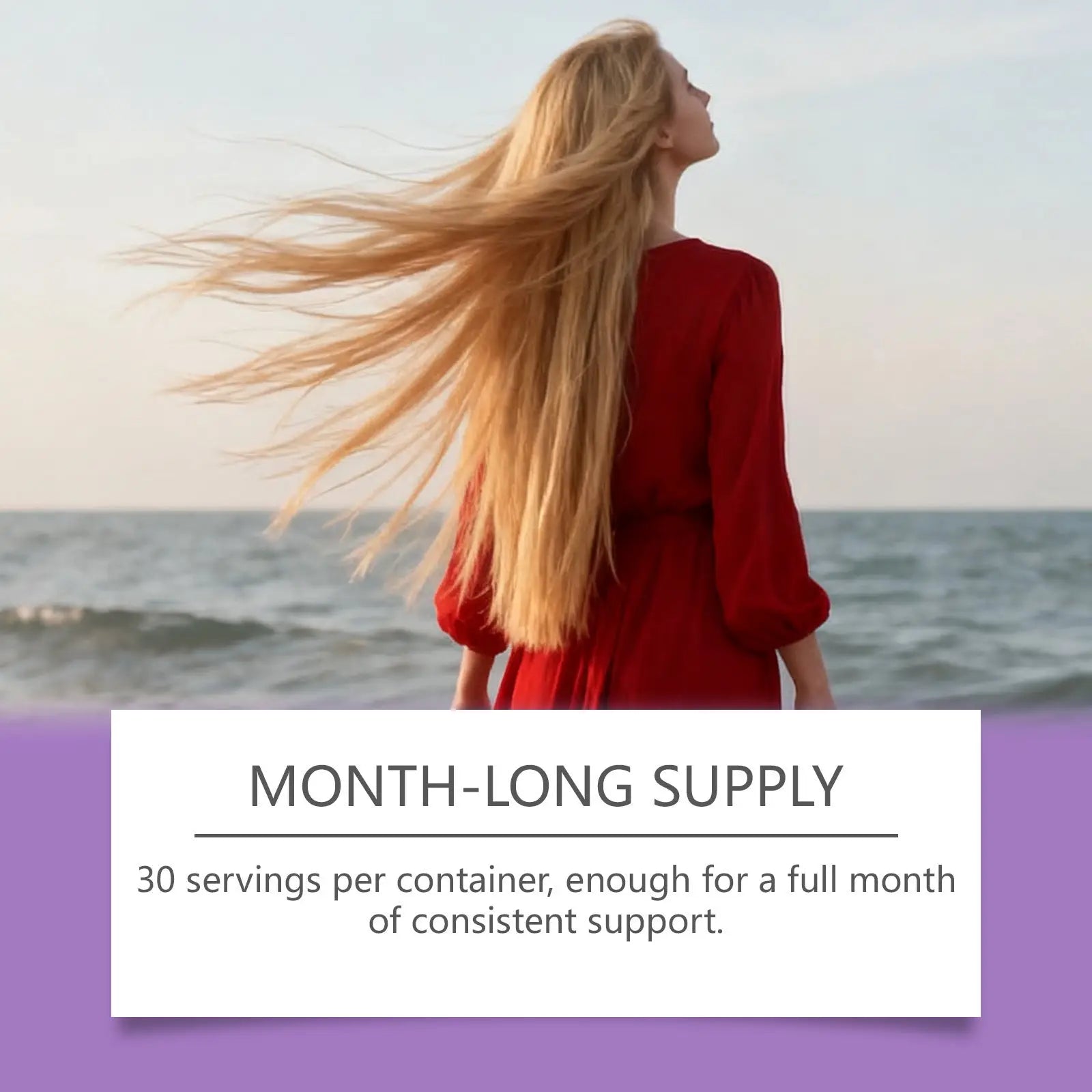 A woman with long blonde hair in a red dress stands by the ocean for biotin collagen hair drops raspberry vitamin