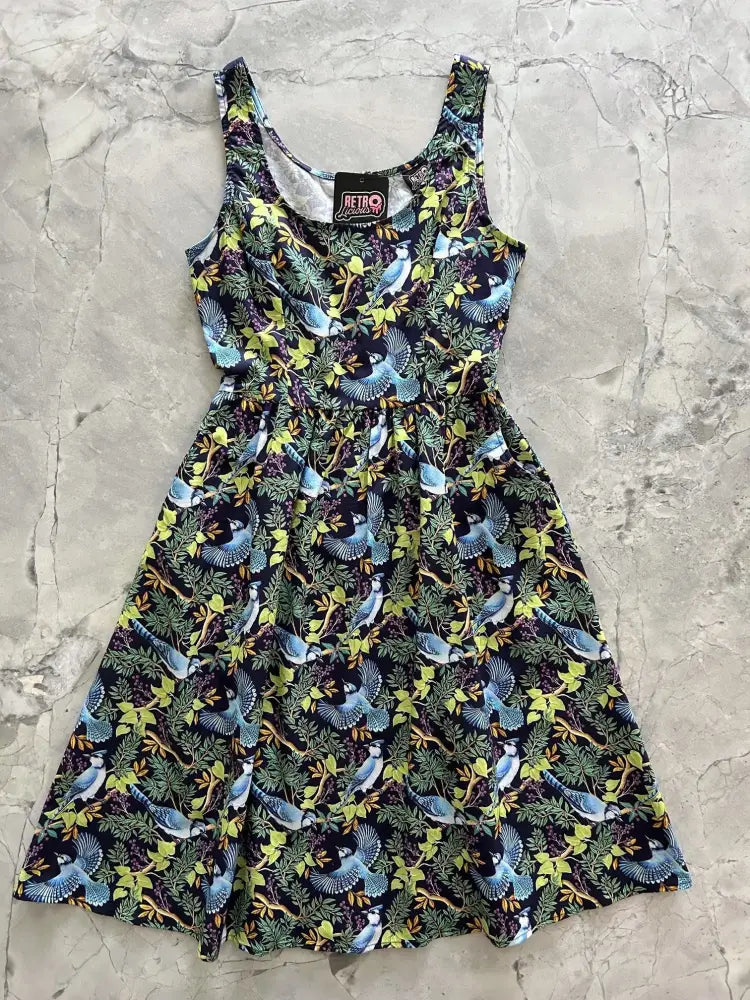 A sleeveless black cotton fit and flare midi dress with blue jay print and gathered waistline