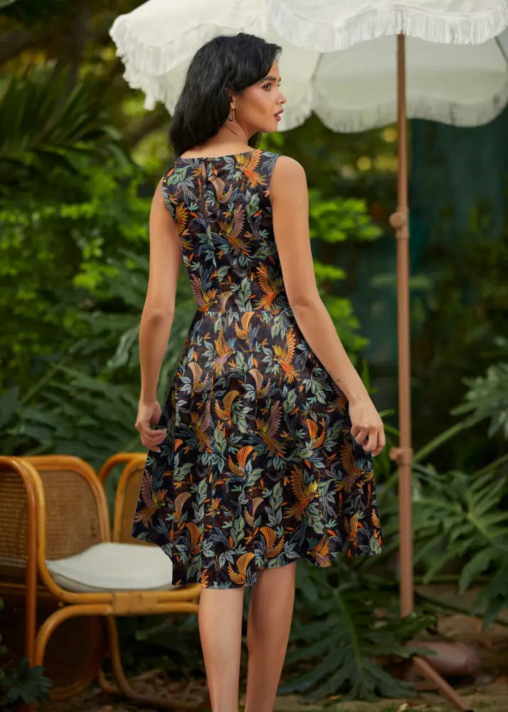 Birds of a feather vintage 1950s sleeveless cotton midi dress with dark navy base and vibrant botanical prints