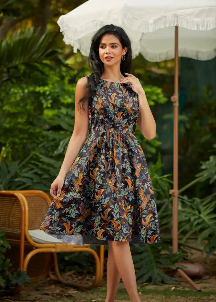 Birds of a feather vintage 1950s sleeveless cotton midi dress with dark navy base and vibrant tropical bird print