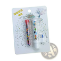 White plastic birthday cake pop-up confetti candle with colorful balloon design and clear tube of rainbow confetti