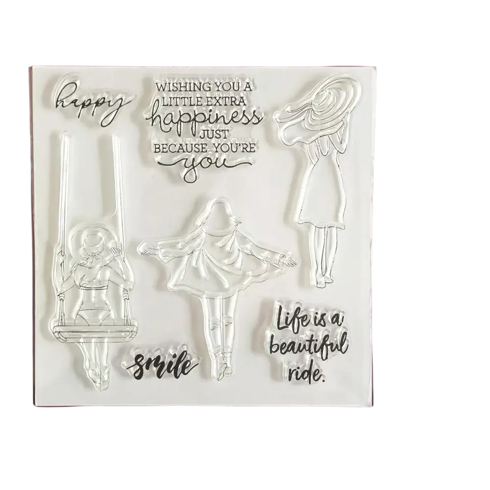 Clear acrylic birthday stamps set with transparent silhouettes of women and inspirational phrases for crafting