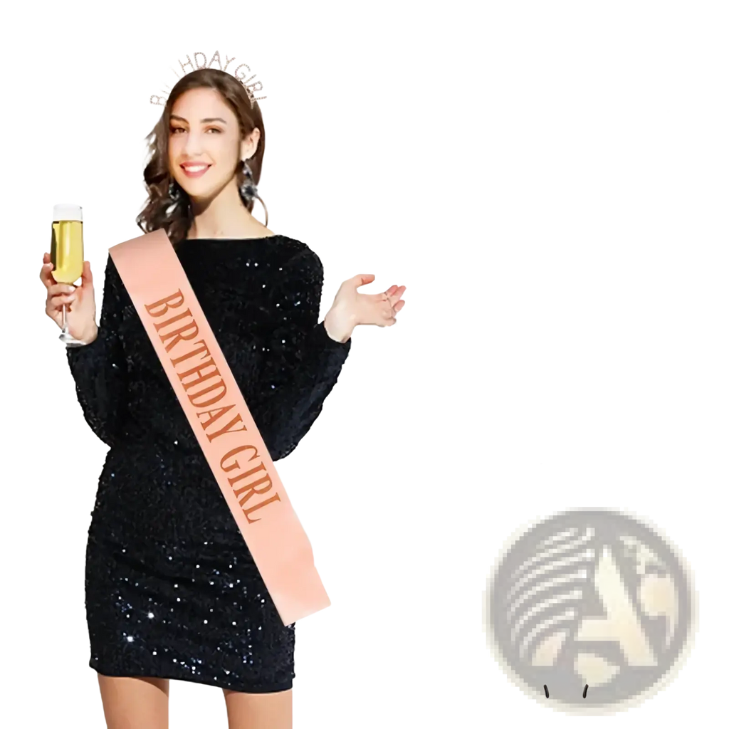 A shimmering rose gold birthday girl sash with glittery text worn over a sequined black dress for celebrations
