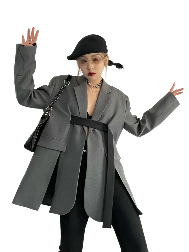 Gray oversized blazer with black belted waist and chain strap bag shown from the front