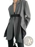 Gray oversized blazer with black belt and asymmetrical hem showcasing a modern tailored design