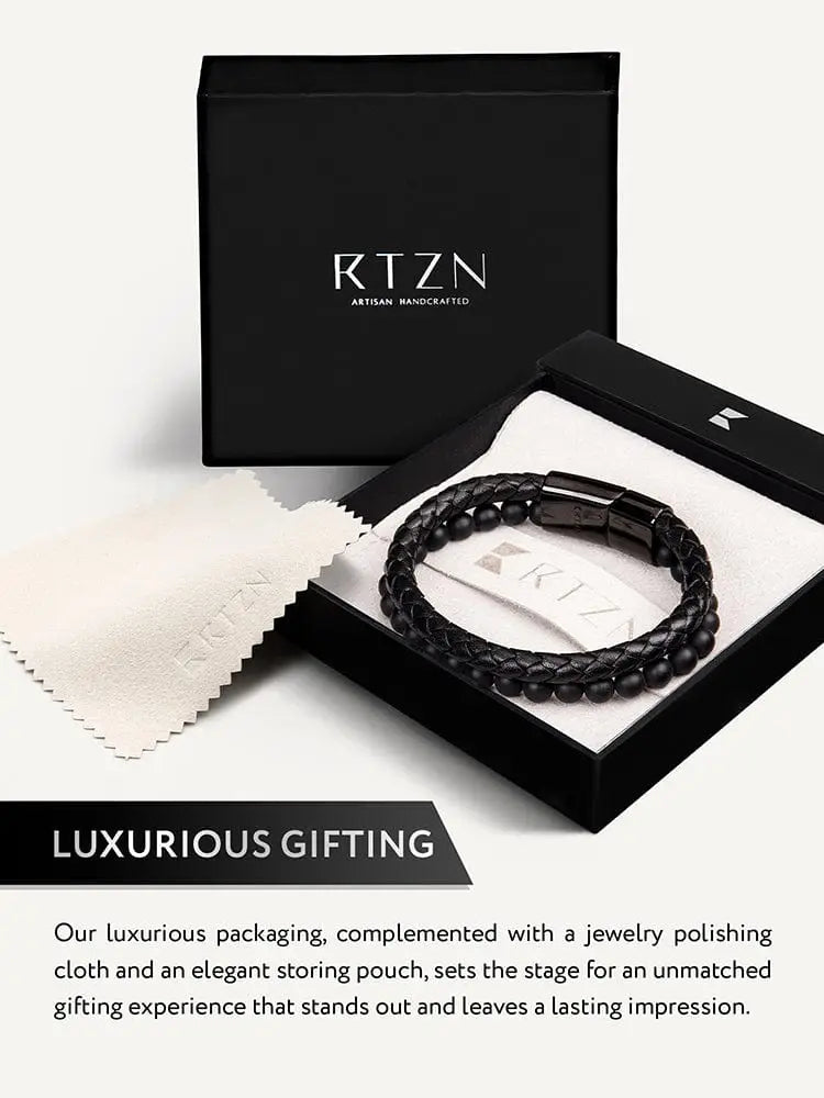Black onyx and braided leather bracelet with sleek steel clasp in elegant black artisan packaging