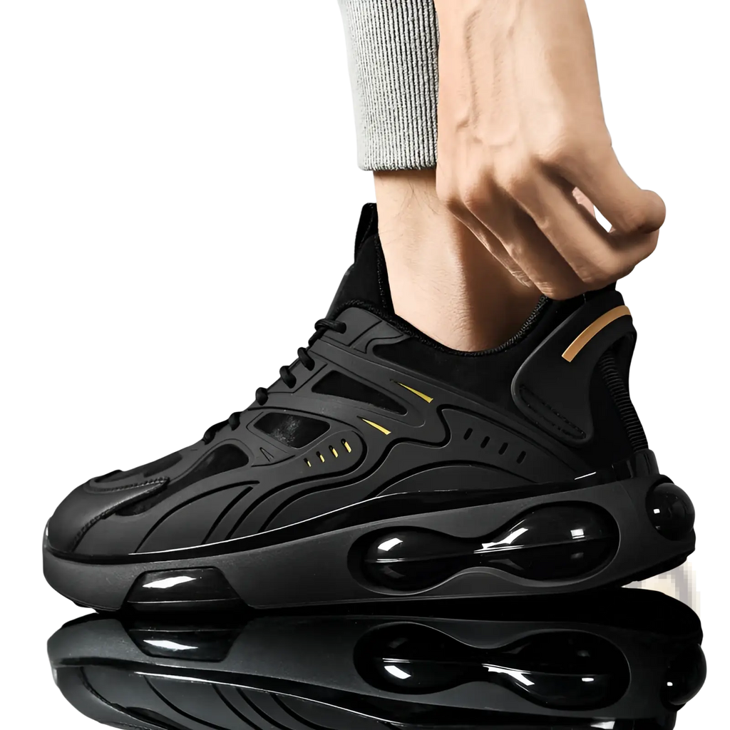 Black breathable mesh sneaker with glossy air cushioning units and subtle gold accent stripes