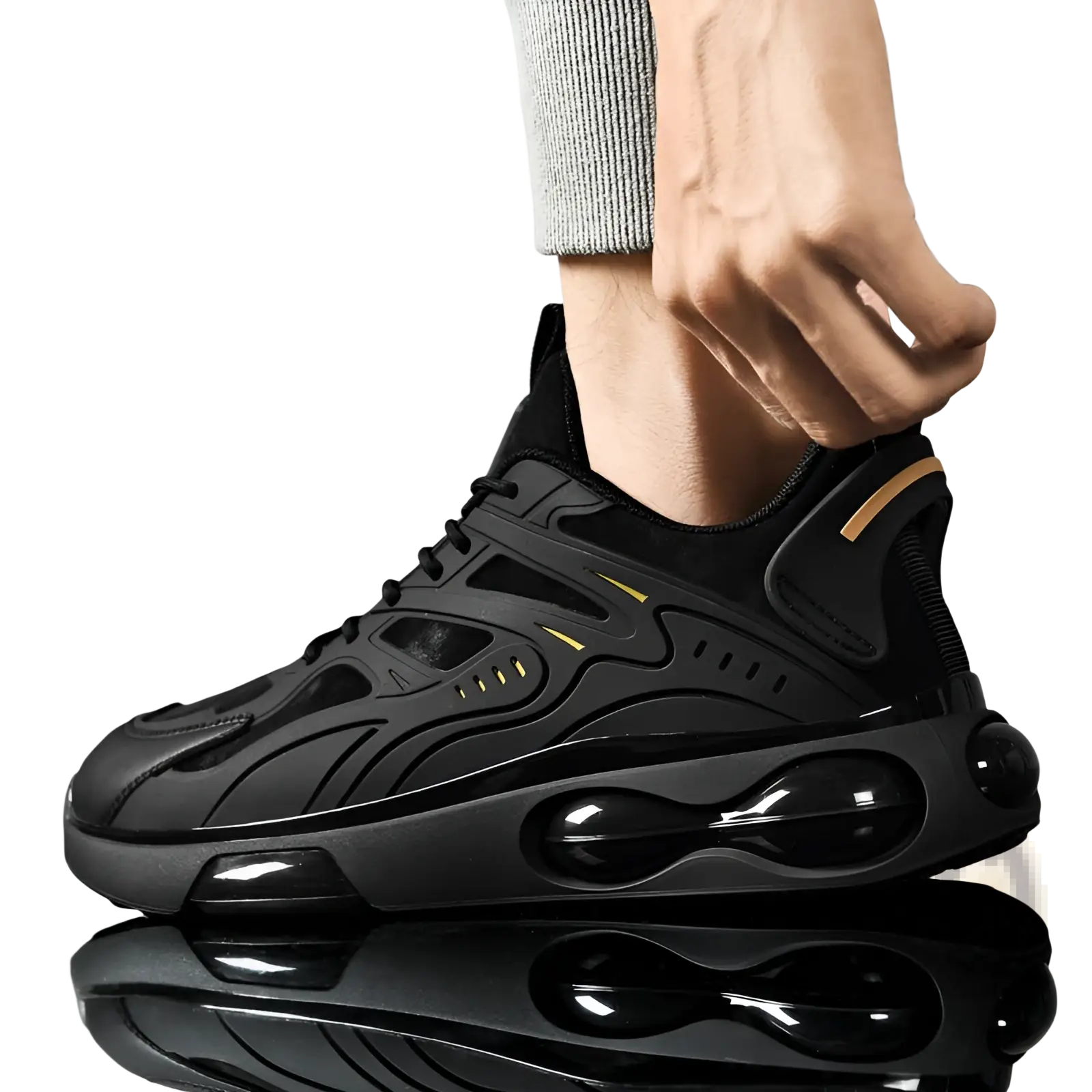 Black breathable mesh sneaker with glossy air cushioning units and subtle gold accent stripes