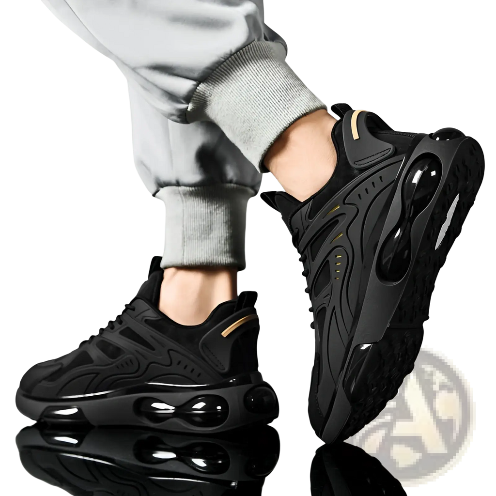 Black breathable mesh sneakers with glossy air cushioning units and subtle gold accents on the heel