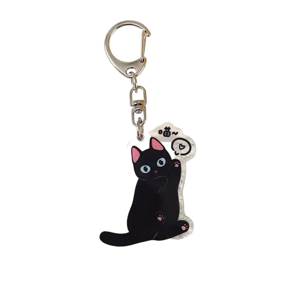 A clear acrylic black cat keychain with pink ears and paws blue eyes and a cute expression bag charm