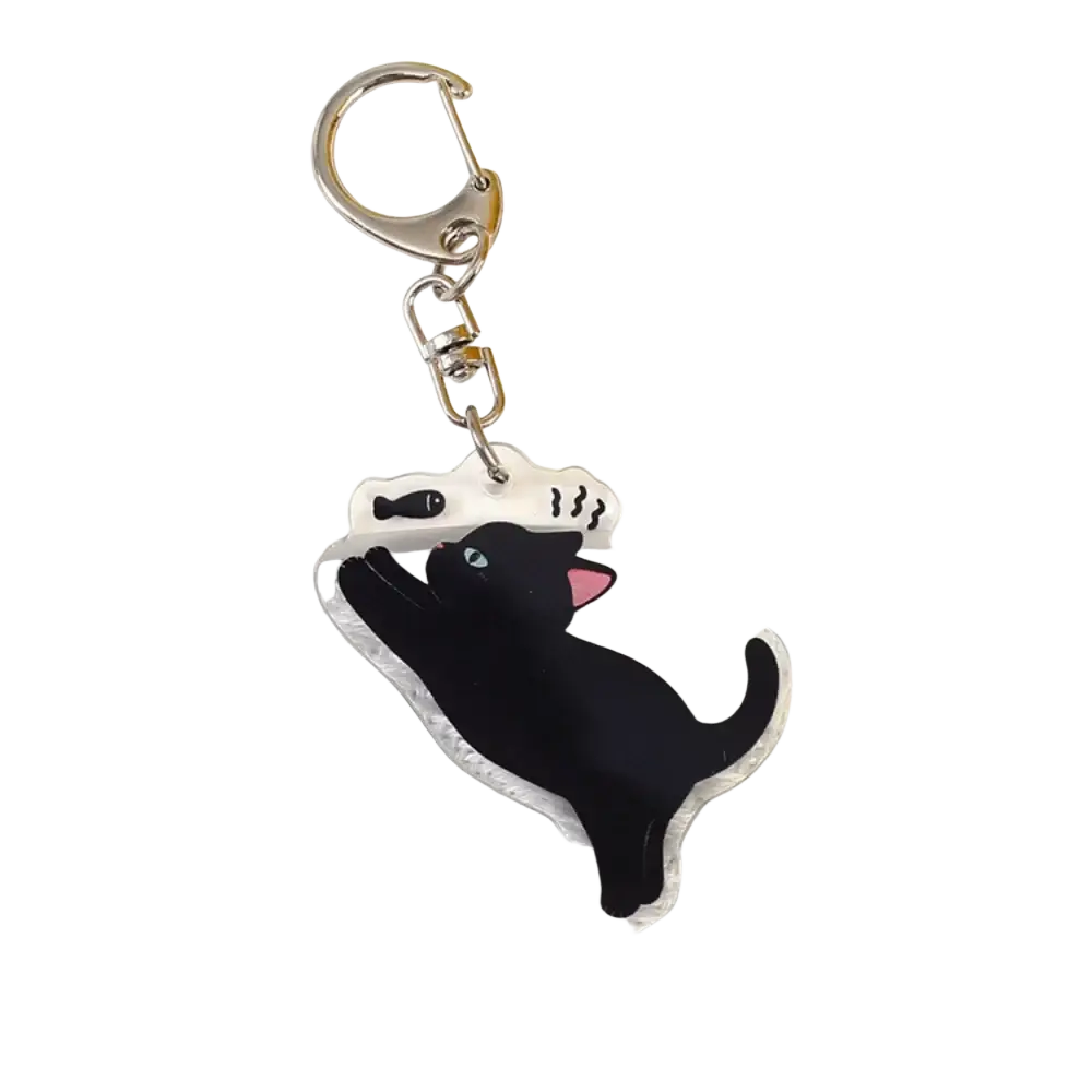 Clear acrylic black cat keychain with pink ears and blue eyes reaching for fish ideal as a cartoon animal bag charm