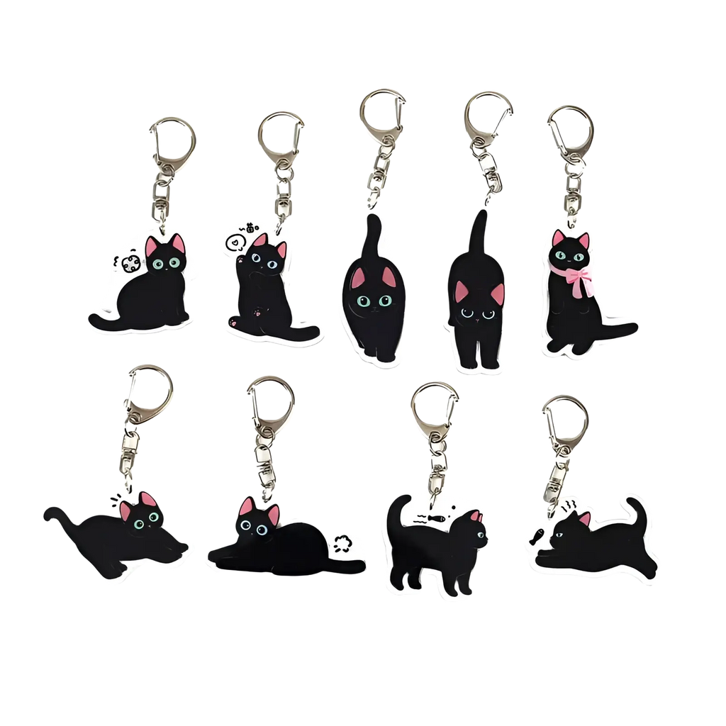 Set of ten black cat acrylic keychains with pink ears and green eyes in various poses for bag charm use