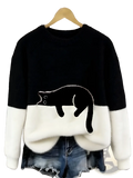 Black and white fleece pullover sweater featuring a black cat appliqué perfect for Christmas wear