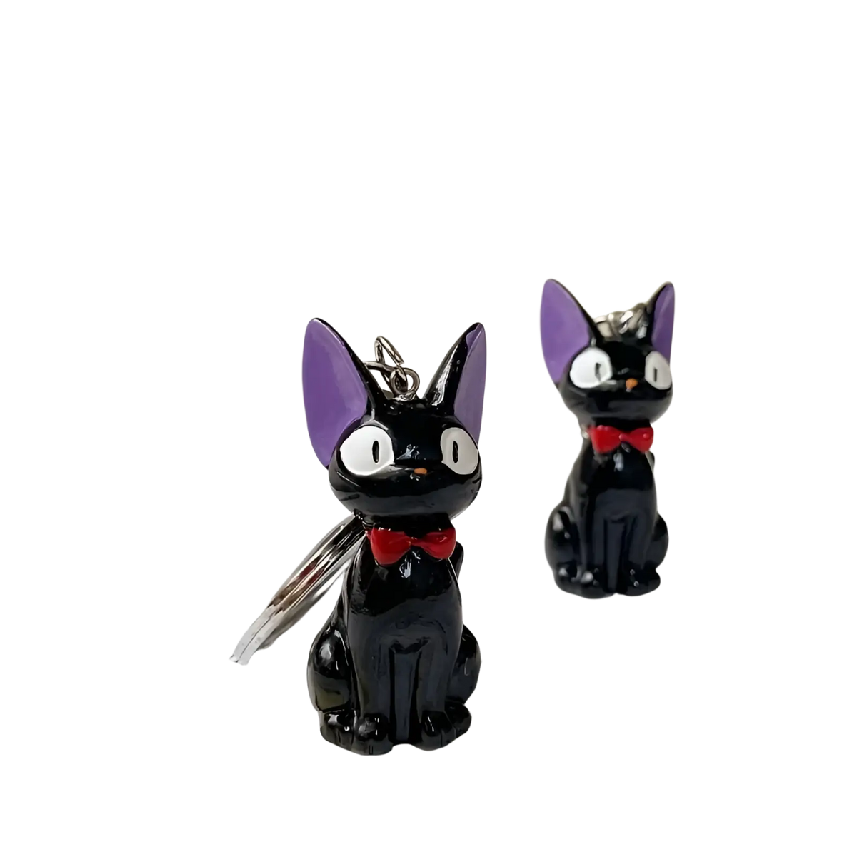 Black cat keychain with purple ears and red bow tie made of pvc used as a cute bag charm accessory