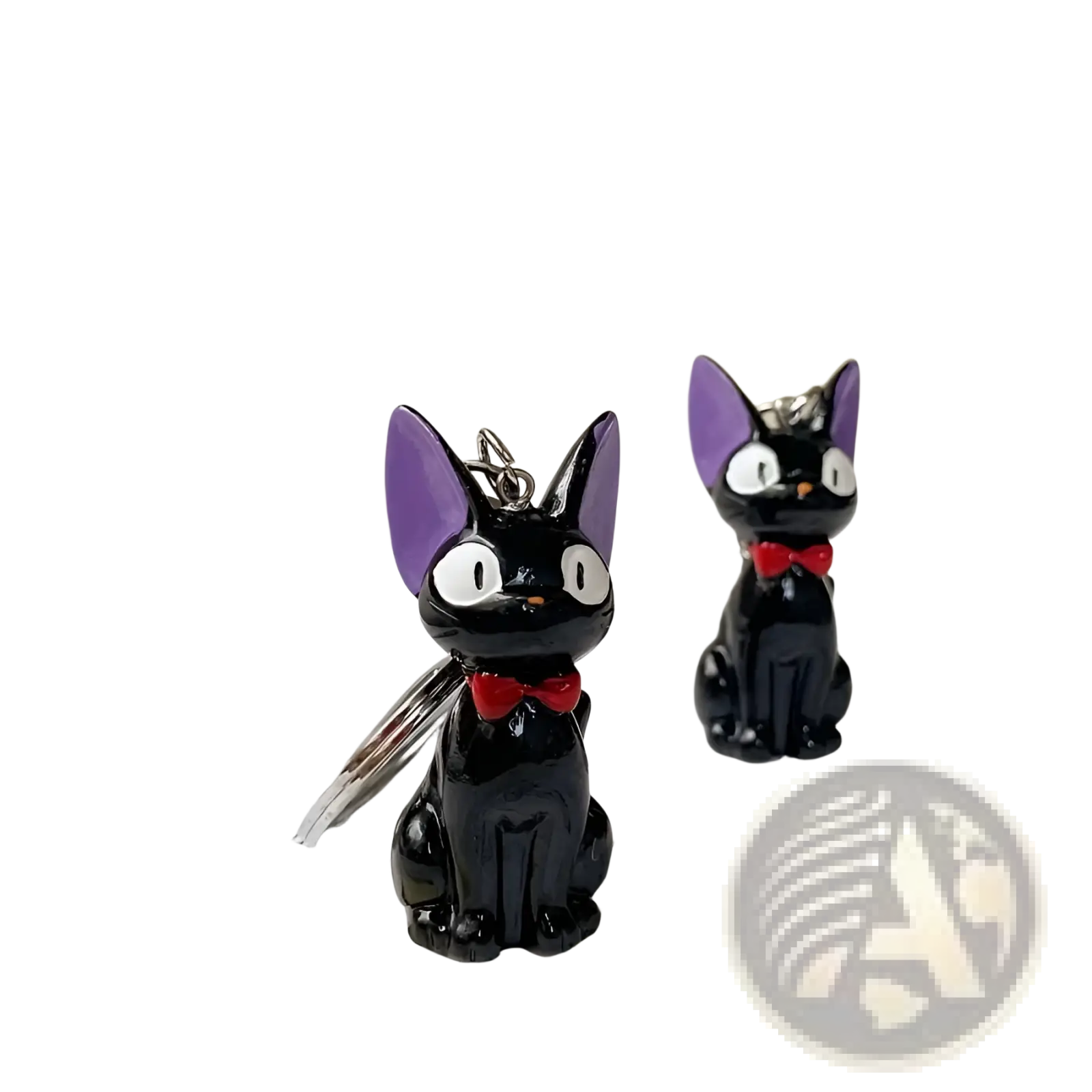 Black cat keychain with purple ears and red bow tie made of pvc used as a cute bag charm accessory
