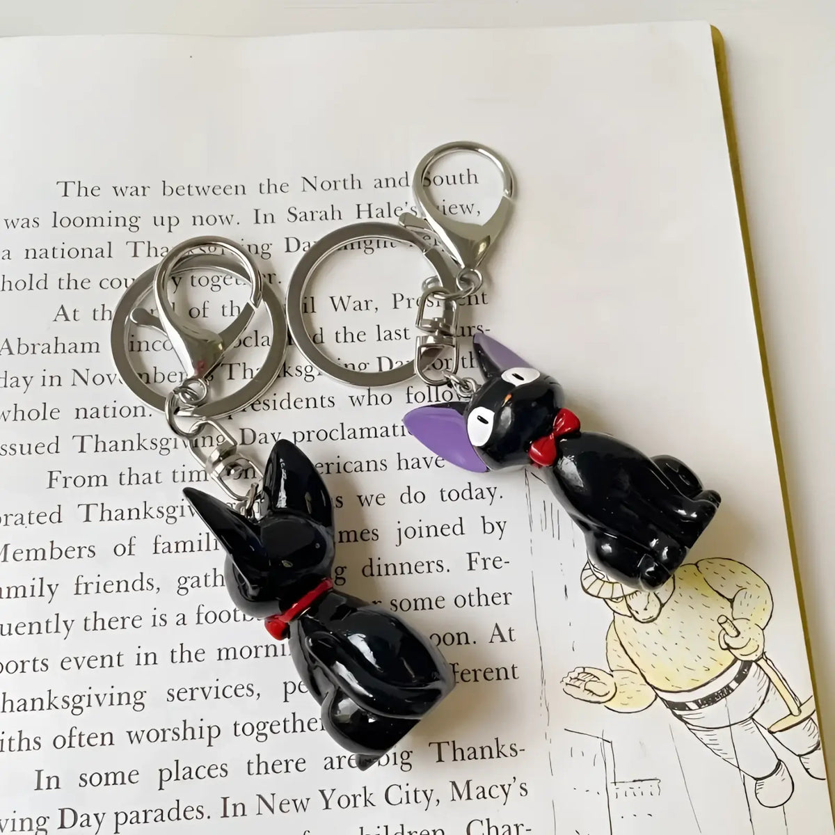Black glossy pvc cat keychain with purple ears and red bow tie cute bag charm accessory
