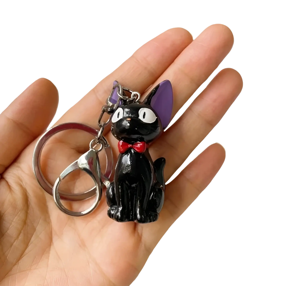 Black cat keychain with shiny enamel finish featuring purple ears and red bow made of pvc for bag charm use