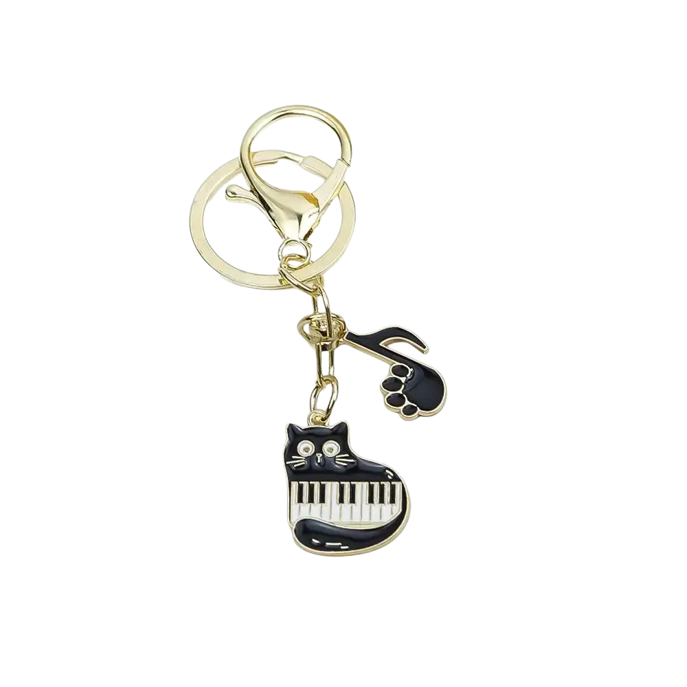 Gold-toned black cat enamel keychain with piano keys and musical note charm for music lover gift