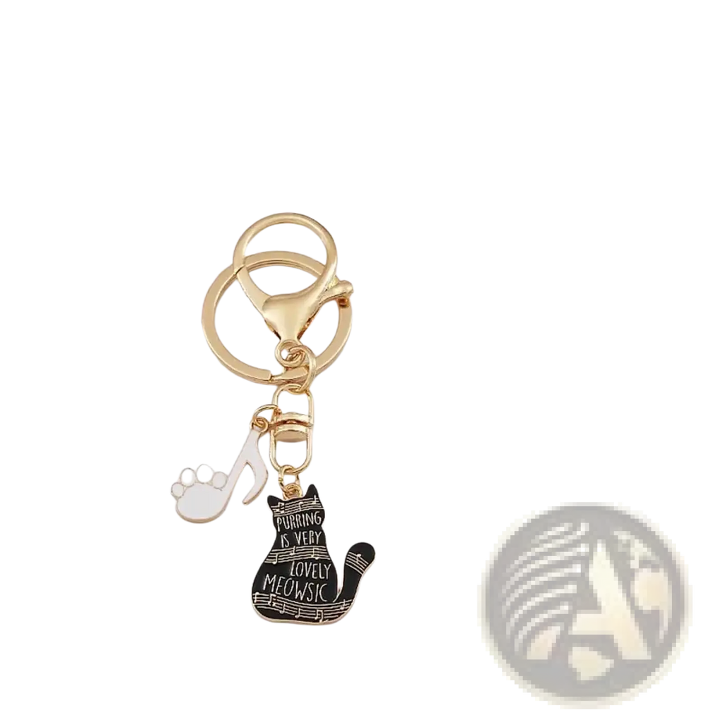 Gold-toned keychain with black enamel cat charm featuring white text and musical notes for music lovers gift