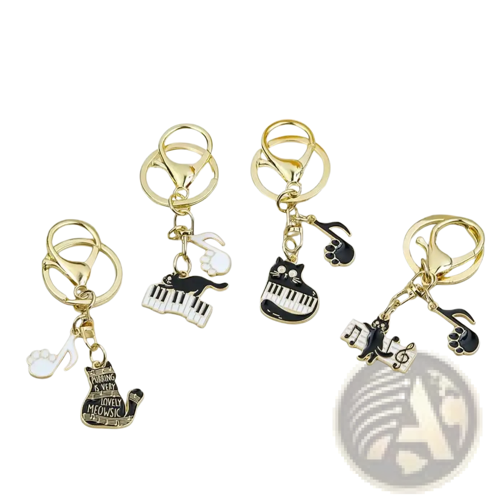 Gold-toned keychains with black and white enamel cat designs featuring piano keys musical notes and paw prints