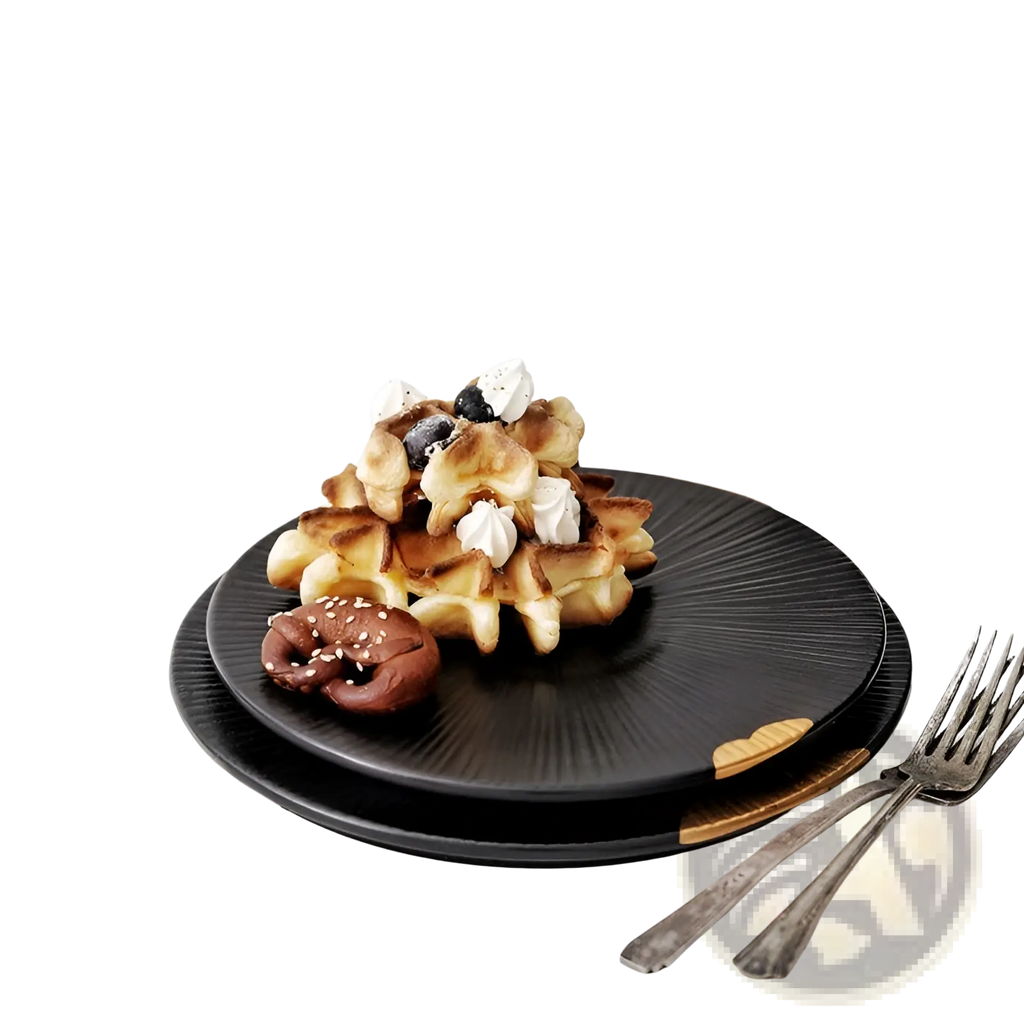 Black ceramic plate with gold and wood rim accents holding golden-brown waffles topped with whipped cream and blueberries