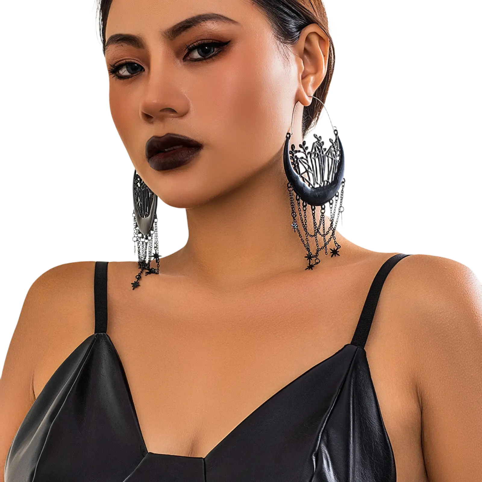 Black crescent moon tassel earrings featuring intricate filigree detailing and dangling star chains in black metal