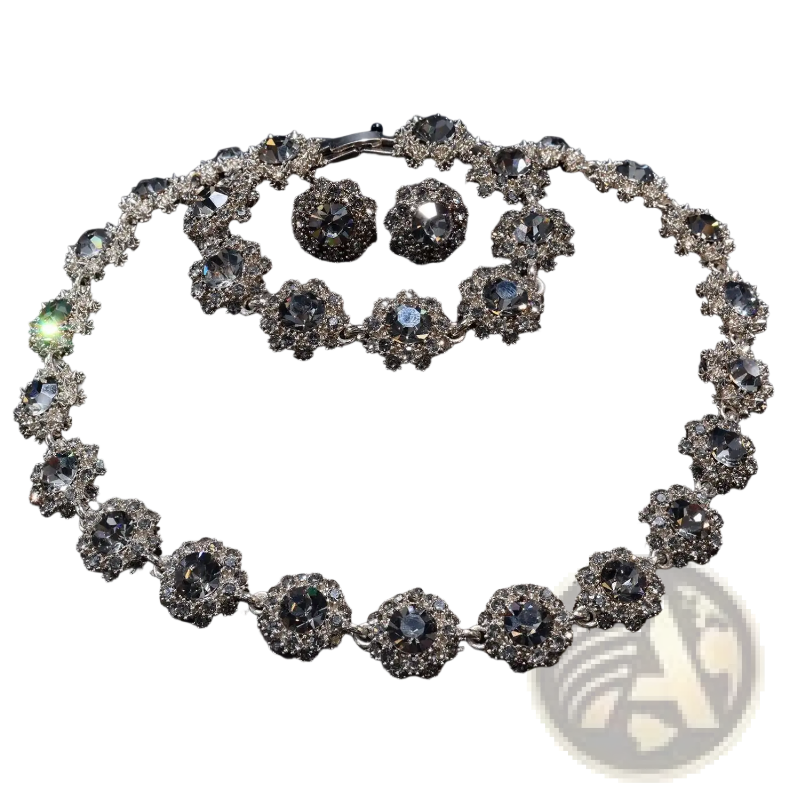 Elegant silver-toned black crystal jewelry set with intricate floral designs featuring clear crystals and rhinestones