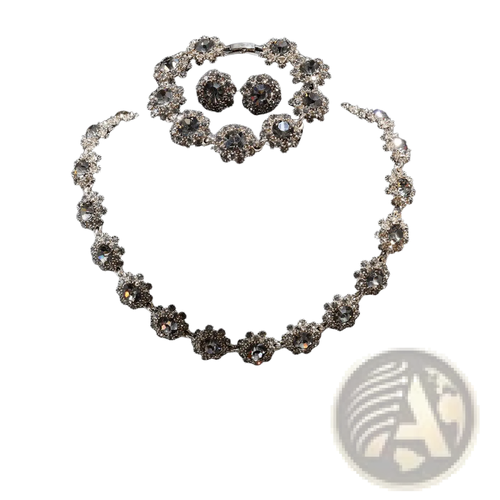 Silver-toned black crystal jewelry set featuring a necklace bracelet and earrings with intricate floral designs