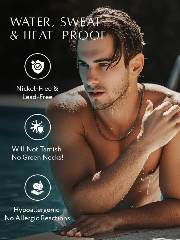 A dark sleek black diamond cut Cuban link chain in stainless steel worn by a man in water