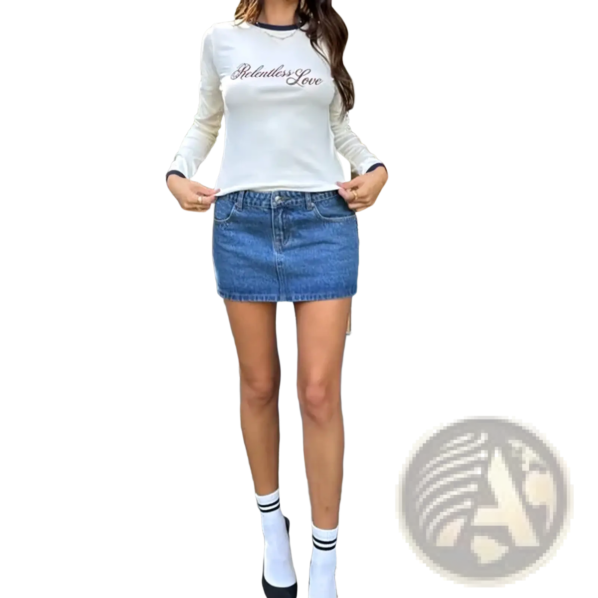 White long-sleeved top with relentless love embroidered in black script paired with a black denim pencil skirt