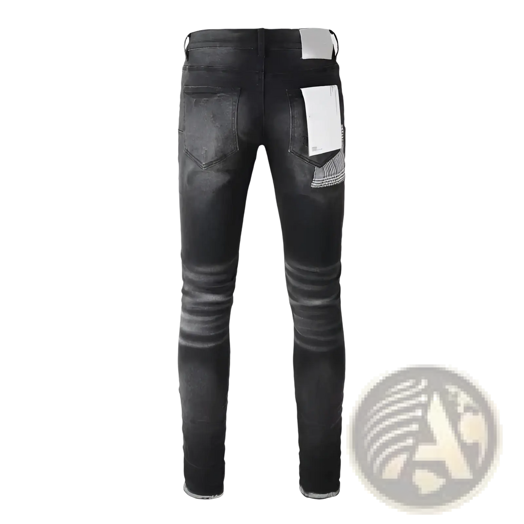 Black distressed patchwork skinny jeans with faded wash and subtle whiskering details on soft denim fabric