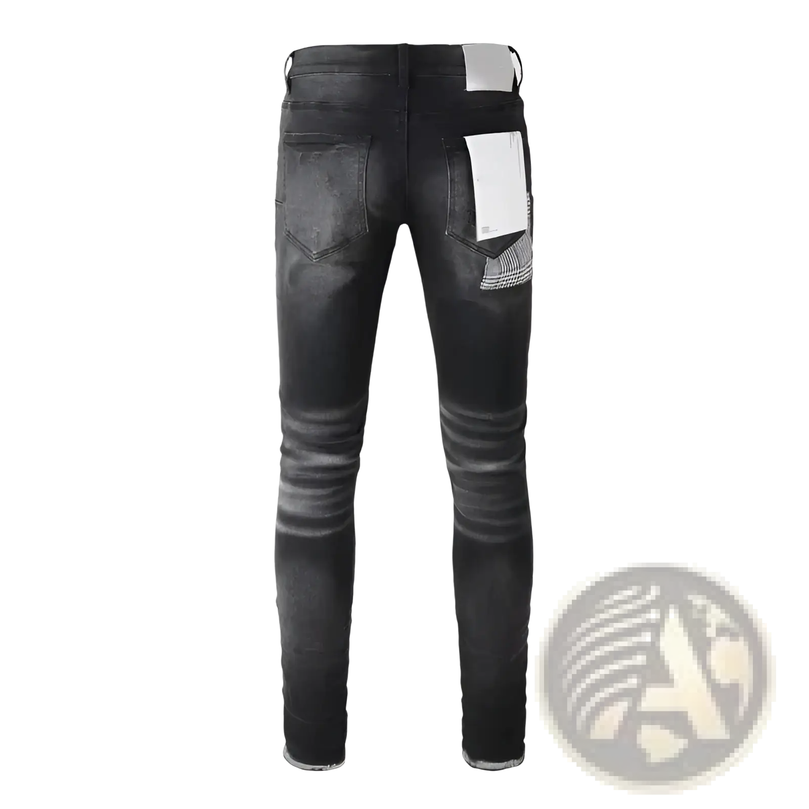 Black distressed patchwork skinny jeans with faded wash and subtle whiskering details on soft denim fabric