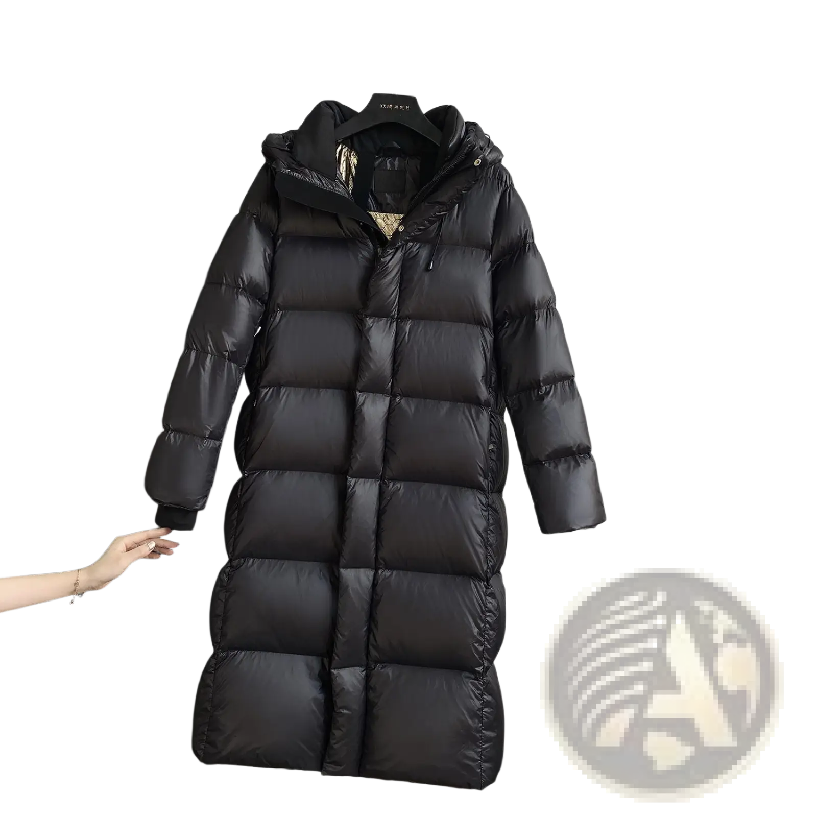 Black down jacket hooded quilted puffer coat made of insulated material hanging on a rack