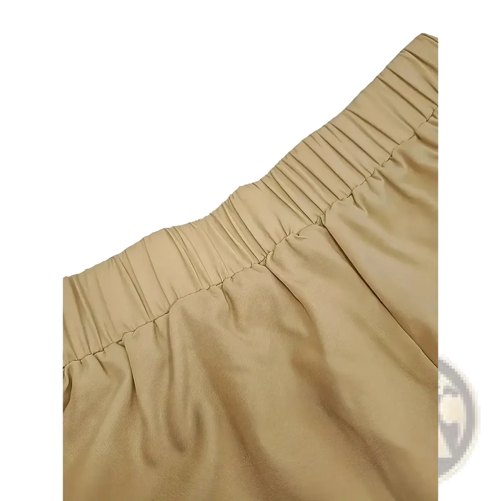 Beige pleated waistband detail of casual pants paired with black embroidered kurta set ethnic two piece outfit