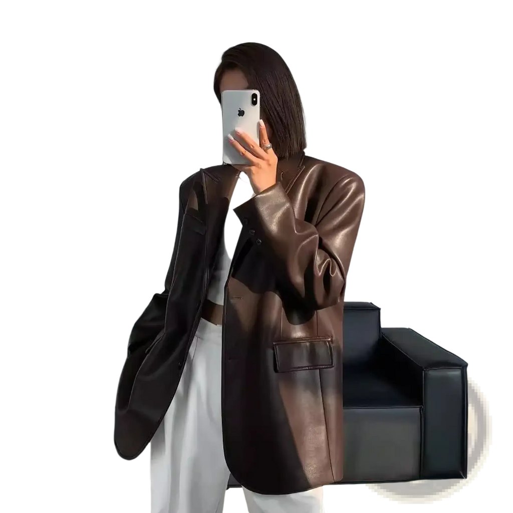 A sleek oversized brown leather blazer with glossy finish and structured shoulders for women loose fit jacket