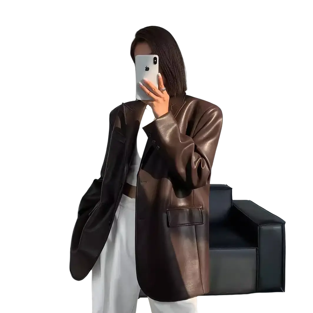 A sleek oversized brown leather blazer with glossy finish and structured shoulders for women loose fit jacket