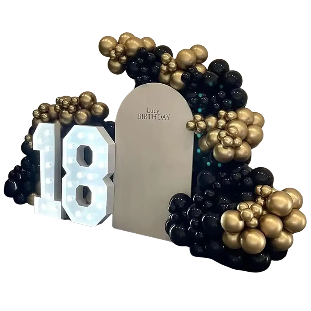 Black gold balloon arch kit with white illuminated 18 sign and arched backdrop reading lucy birthday