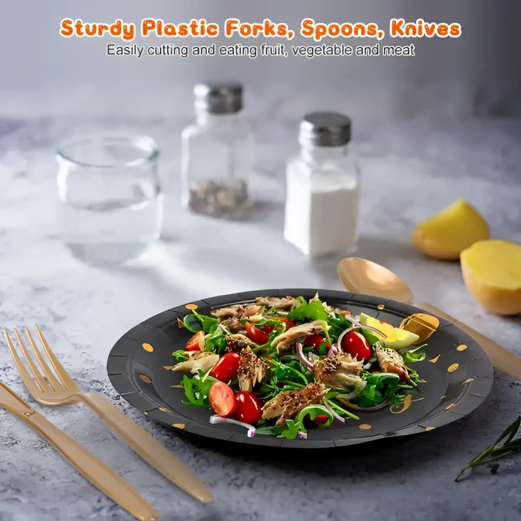 Black paper plate with gold polka dots holding fresh salad from black gold birthday party supplies set for 25 guests