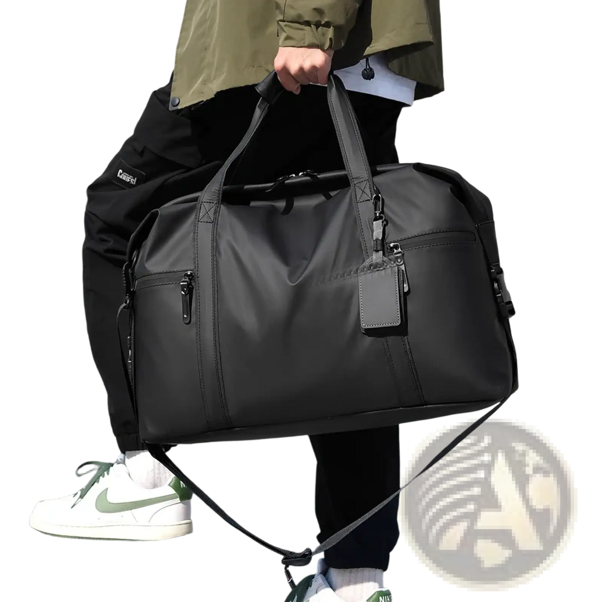 Black gym duffel bag made of nylon with multiple zippers and detachable shoulder strap for travel and fitness gear