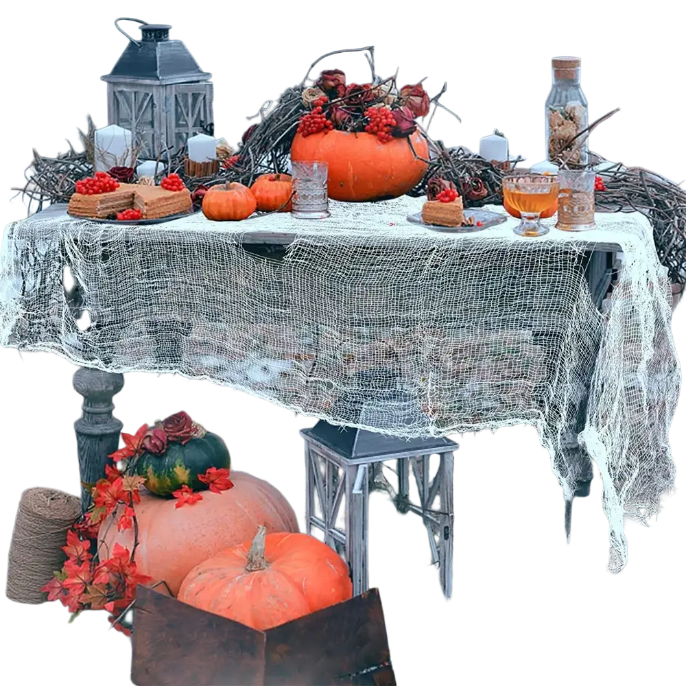A black halloween gauze spiderweb party decoration on a rustic wooden table with lace cloth and autumnal pumpkins for april fool’s day