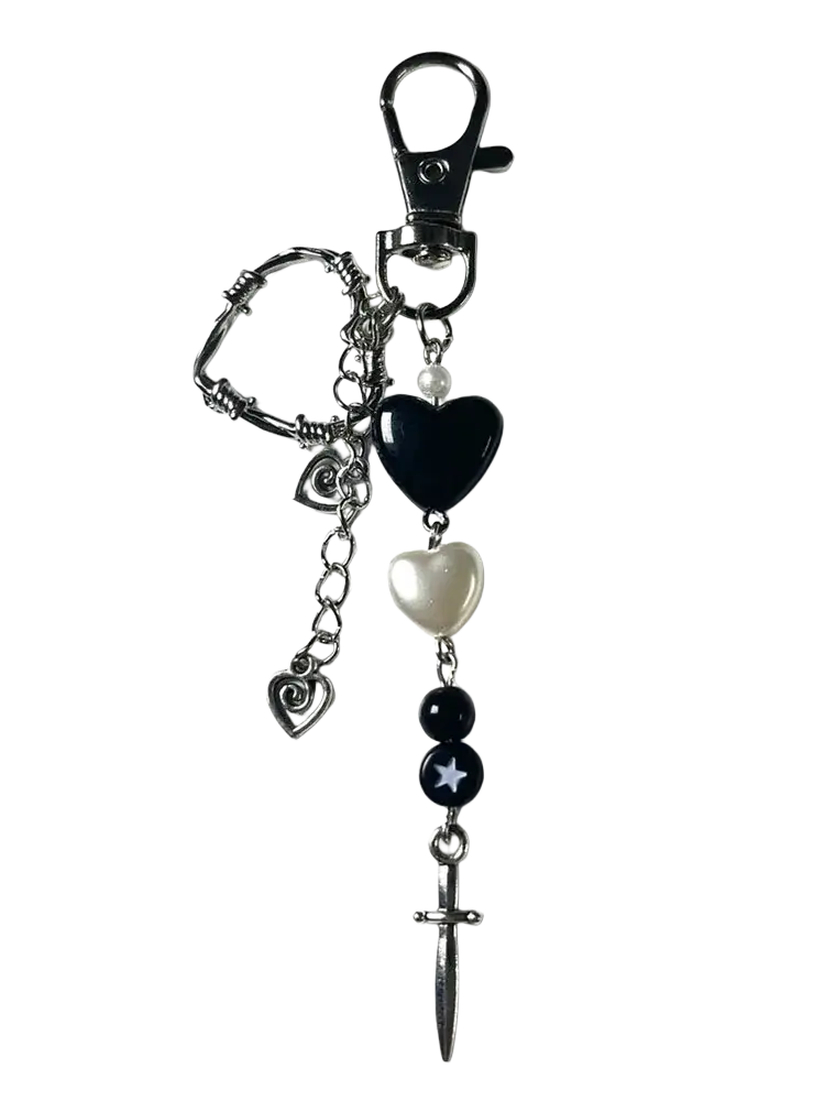 Black heart dagger keychain featuring black and silver barbed wire design with pearl accents and a dagger charm