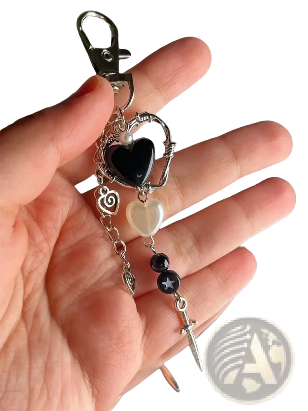 Black heart dagger keychain aesthetic charm with a black resin heart wirework and silver-toned metal accents with pearls and sword pendant