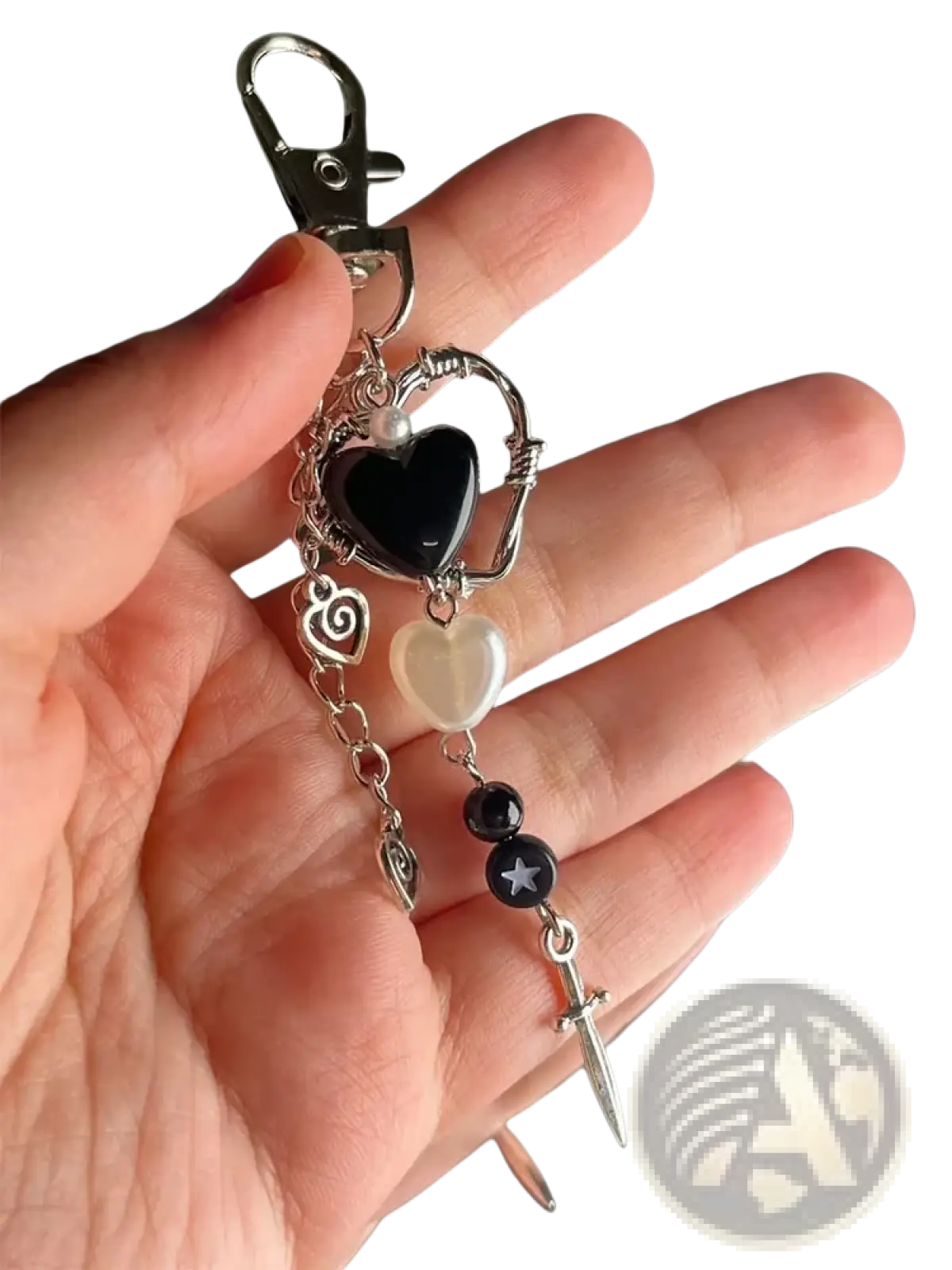 Black heart dagger keychain aesthetic charm with a black resin heart wirework and silver-toned metal accents with pearls and sword pendant