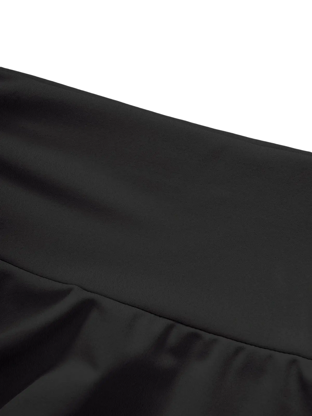 Black high waist ruffle mini skirt in black satin with smooth glossy finish and subtle pleats along the hem