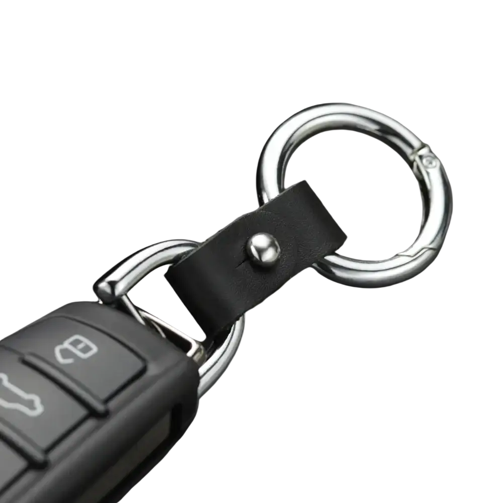 Black leather car keychain with silver hardware featuring metal rings and a snap closure for secure use