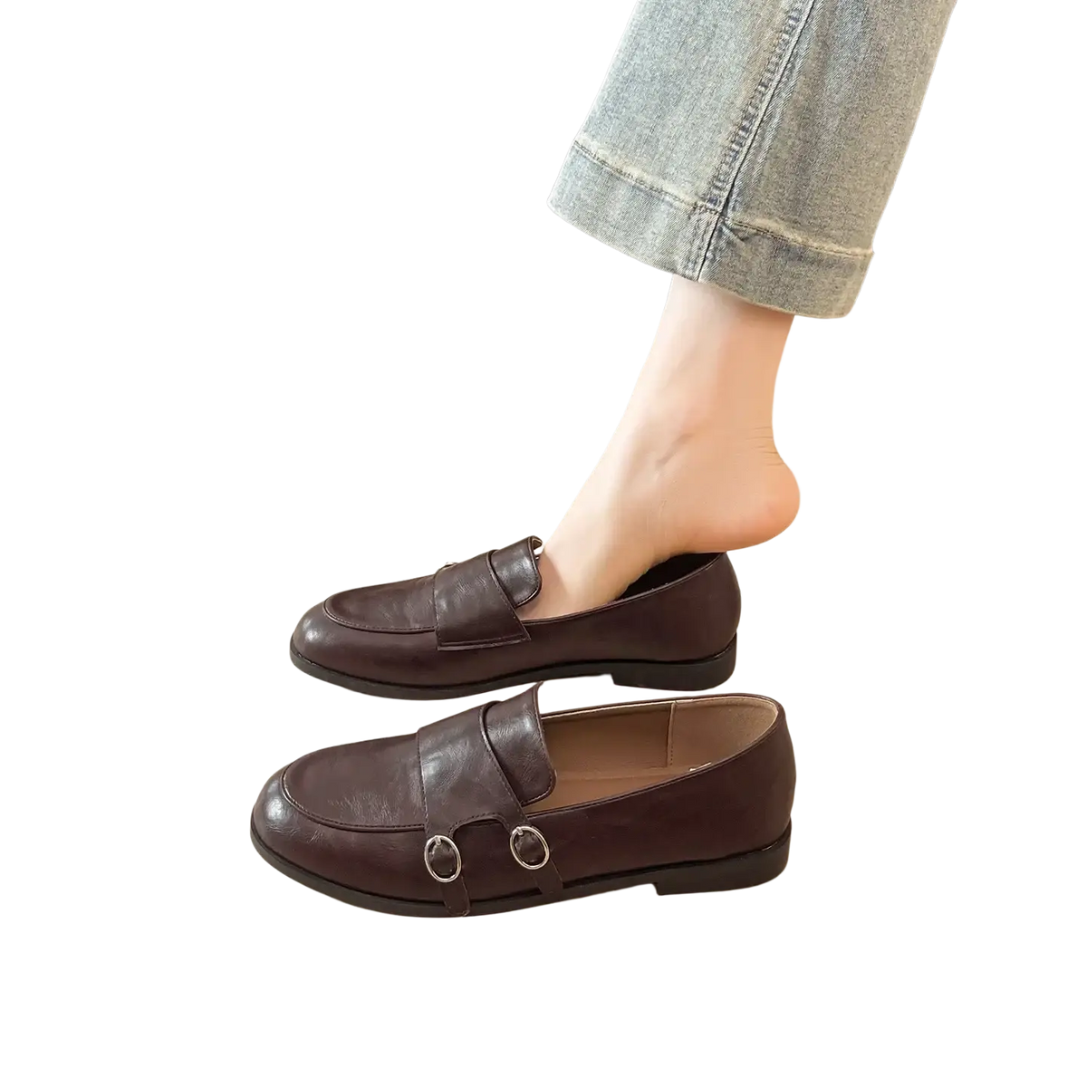 Black leather double buckle retro loafers with sleek minimalist design and two silver toned metal buckles on front